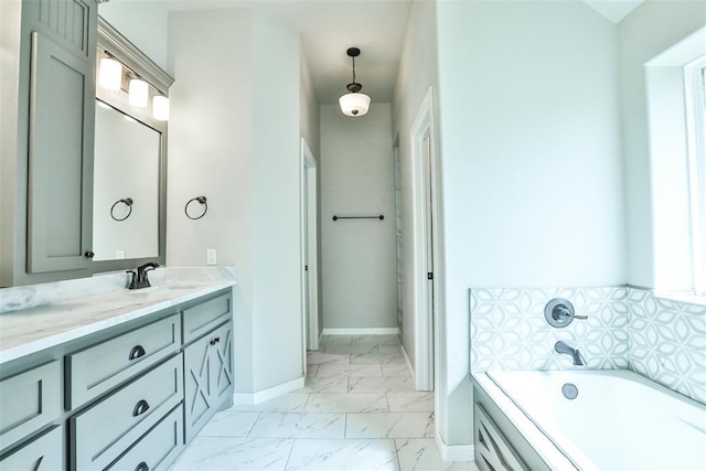 12016 SW 50th St, Mustang, OK 73064 - full bathroom featuring marble look tiles, vanity, a garden tub, and healthy amount of natural light