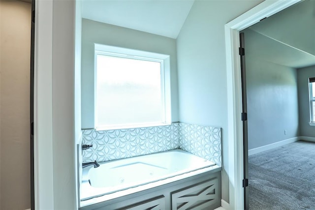 12016 SW 50th St, Mustang, OK 73064 - bathroom with a tub with jets and decorative backsplash