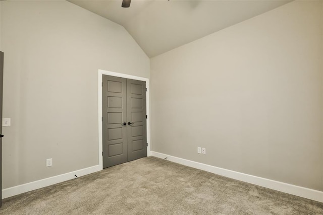 12016 SW 50th St, Mustang, OK 73064 - spare room featuring carpet, lofted ceiling, and ceiling fan