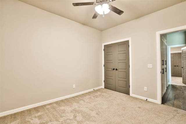 12016 SW 50th St, Mustang, OK 73064 - unfurnished bedroom with dark colored carpet and a ceiling fan