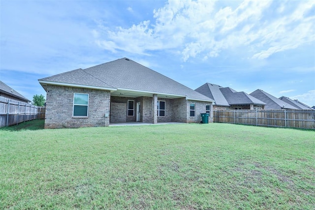 12016 SW 50th St, Mustang, OK 73064 - back of house featuring a fenced backyard, a patio, and roof with shingles