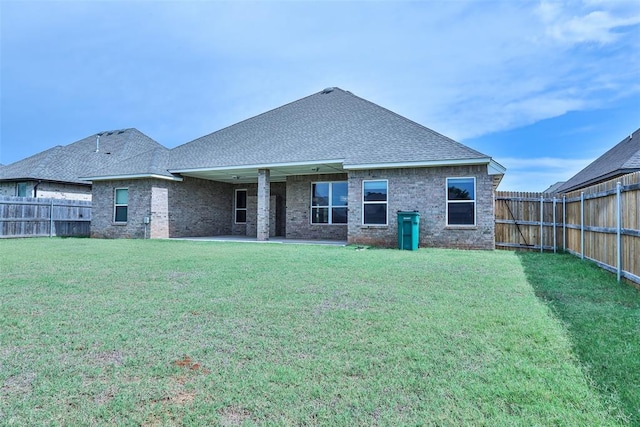 12016 SW 50th St, Mustang, OK 73064 - rear view of house featuring a fenced backyard, a patio area, a shingled roof, and brick siding