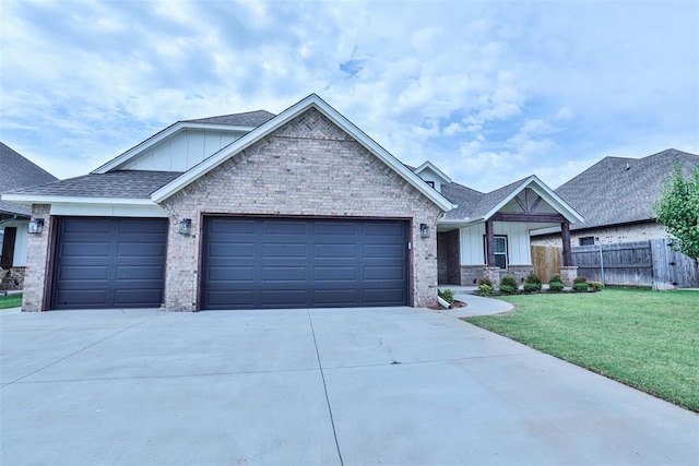 12016 SW 50th St, Mustang, OK 73064 - view of front of house featuring board and batten siding, an attached garage, concrete driveway, brick siding, and a shingled roof