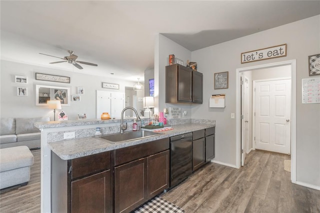 11513 Ruger Rd, Yukon, OK 73099 - kitchen featuring a sink, dishwasher, open floor plan, wood finished floors, and dark brown cabinets