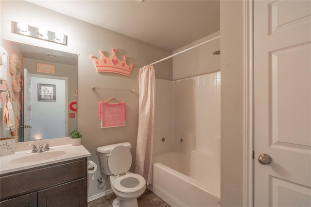 11513 Ruger Rd, Yukon, OK 73099 - bathroom featuring toilet, vanity, shower / bath combo, baseboards, and wood finished floors