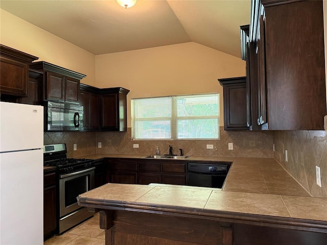 1523 Morland St, Norman, OK 73071 - kitchen with freestanding refrigerator, stainless steel range with gas stovetop, black microwave, dishwasher, and a sink