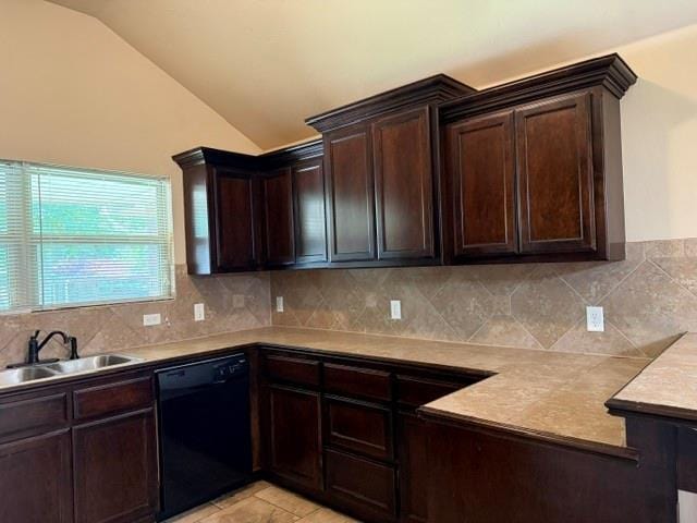1523 Morland St, Norman, OK 73071 - kitchen with black dishwasher, dark brown cabinetry, vaulted ceiling, tasteful backsplash, and light countertops