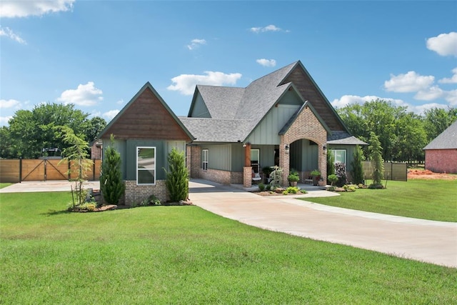 3154 Red Ridge Dr, Blanchard, OK 73010 - craftsman inspired home featuring roof with shingles, brick siding, a gate, and board and batten siding