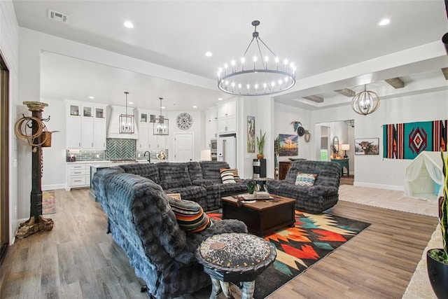 3154 Red Ridge Dr, Blanchard, OK 73010 - living room with a chandelier, light wood-type flooring, recessed lighting, and baseboards