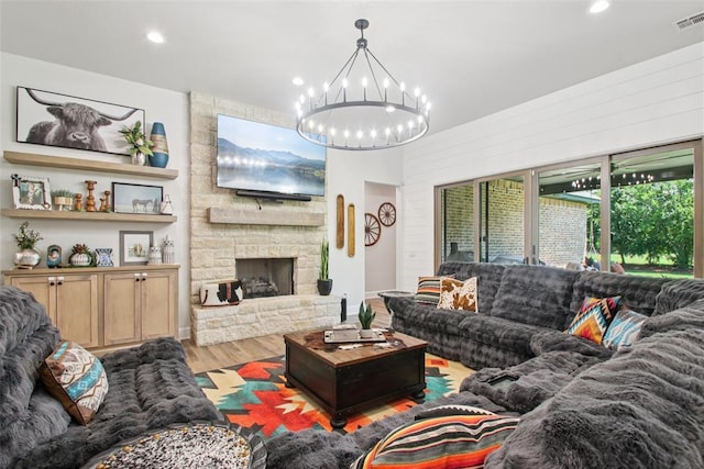 3154 Red Ridge Dr, Blanchard, OK 73010 - living area with a chandelier, wood finished floors, recessed lighting, and a stone fireplace
