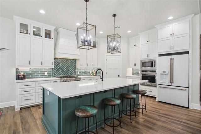 3154 Red Ridge Dr, Blanchard, OK 73010 - kitchen with appliances with stainless steel finishes, white cabinets, a chandelier, light countertops, and recessed lighting