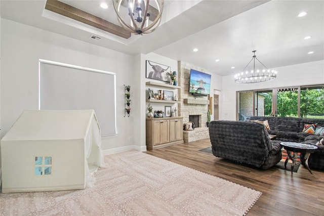 3154 Red Ridge Dr, Blanchard, OK 73010 - living room featuring a chandelier, recessed lighting, wood finished floors, a fireplace, and baseboards