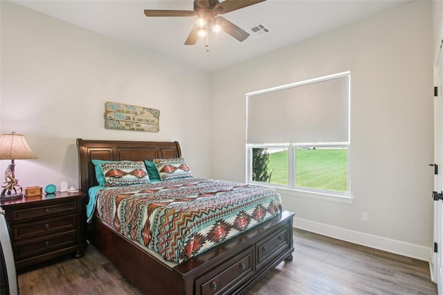 3154 Red Ridge Dr, Blanchard, OK 73010 - bedroom featuring baseboards, dark wood finished floors, and ceiling fan