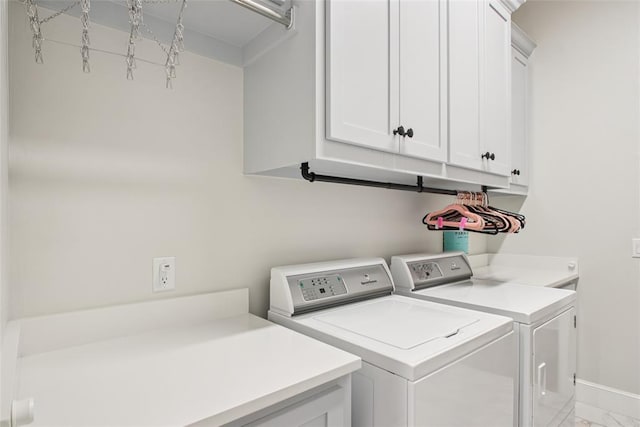 3154 Red Ridge Dr, Blanchard, OK 73010 - laundry room featuring cabinet space, washing machine and dryer, light marble finish flooring, and baseboards