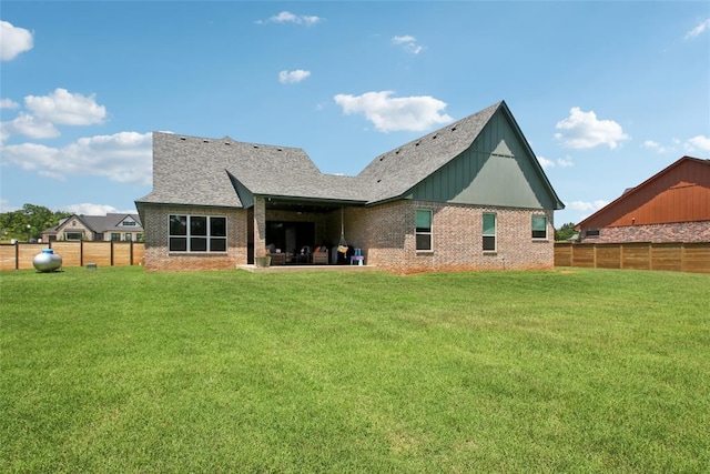 3154 Red Ridge Dr, Blanchard, OK 73010 - back of property with brick siding, roof with shingles, and board and batten siding