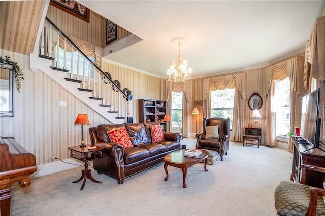 201 W 8th St, Chandler, OK 74834 - carpeted living room with wallpapered walls, a chandelier, stairs, and crown molding