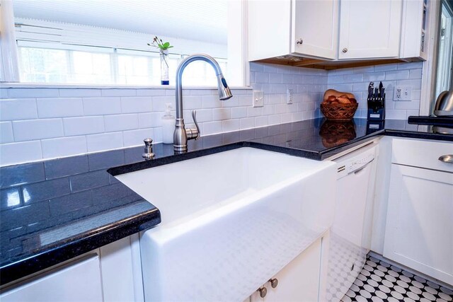 201 W 8th St, Chandler, OK 74834 - kitchen with a sink, dishwasher, white cabinetry, and backsplash