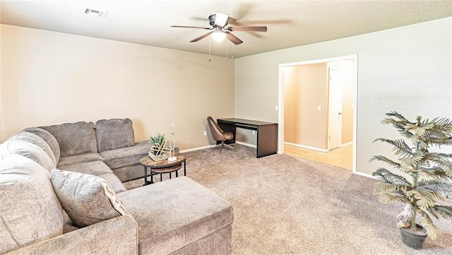 1343 E Moses St, Cushing, OK 74023 - carpeted living room featuring a ceiling fan and baseboards