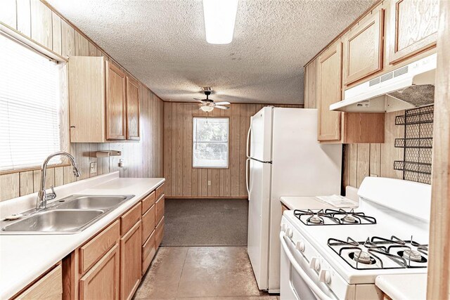 1343 E Moses St, Cushing, OK 74023 - kitchen featuring white gas range oven, under cabinet range hood, a sink, a textured ceiling, and a ceiling fan