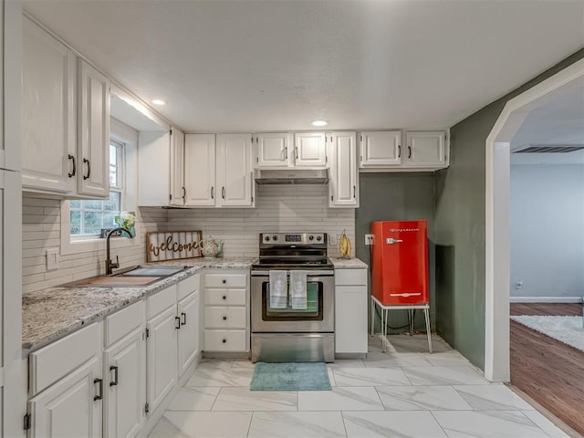 2417 SW 47th St, Oklahoma City, OK 73129 - kitchen featuring stainless steel electric stove, a sink, white cabinetry, and recessed lighting