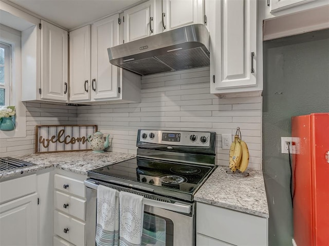 2417 SW 47th St, Oklahoma City, OK 73129 - kitchen featuring stainless steel electric stove, under cabinet range hood, decorative backsplash, and white cabinets