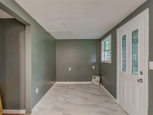 2417 SW 47th St, Oklahoma City, OK 73129 - unfurnished room with attic access, light marble finish flooring, and baseboards