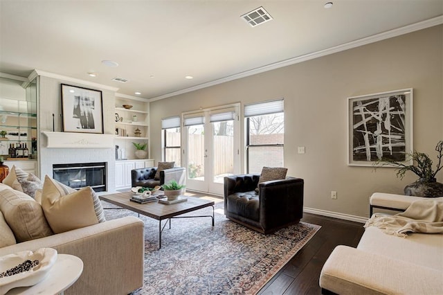 6206 Waterford Blvd Unit 45, Oklahoma City, OK 73118 - living area featuring crown molding, a brick fireplace, baseboards, dark wood finished floors, and recessed lighting