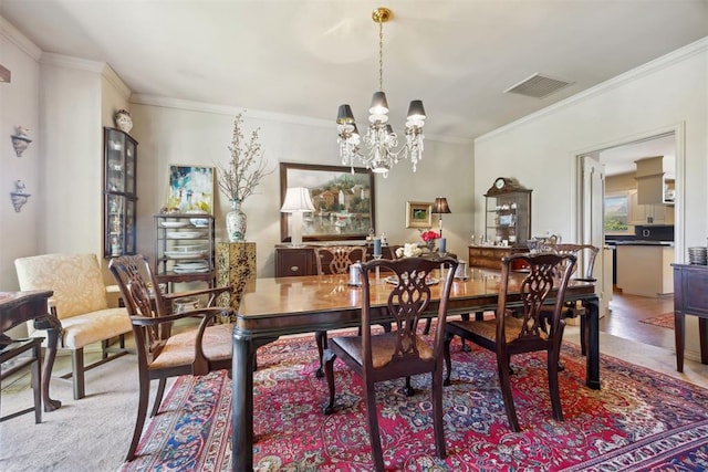 2917 W Pelham Dr, Oklahoma City, OK 73120 - dining area with a chandelier and ornamental molding