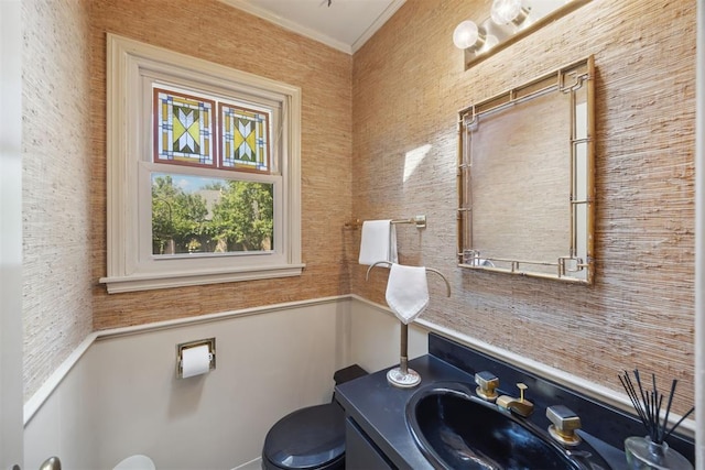 2917 W Pelham Dr, Oklahoma City, OK 73120 - bathroom with vanity, ornamental molding, and wainscoting