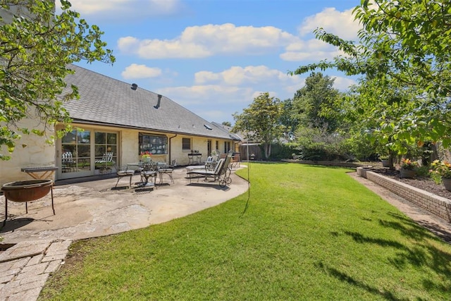 2917 W Pelham Dr, Oklahoma City, OK 73120 - view of yard featuring a patio area and a fire pit