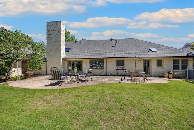 2917 W Pelham Dr, Oklahoma City, OK 73120 - rear view of property with a chimney, a patio, a yard, and stone siding