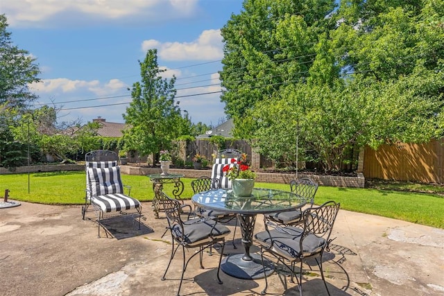 2917 W Pelham Dr, Oklahoma City, OK 73120 - fenced backyard with outdoor dining space and a patio area