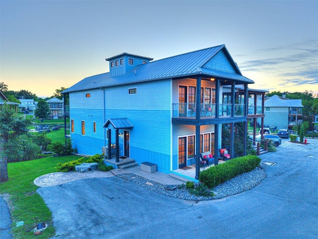 37271 S Cliff Crest Dr, Langley, OK 74301 - view of front of house featuring a balcony, a standing seam roof, and metal roof