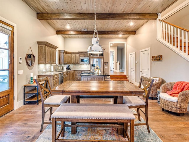37271 S Cliff Crest Dr, Langley, OK 74301 - dining area featuring wood ceiling with exposed beams, light wood finished floors, stairs, and baseboards