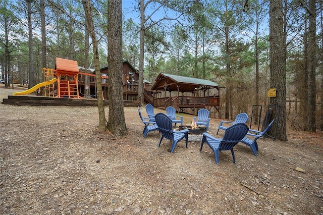 1073 Southern Hills Cir, Broken Bow, OK 74728 - view of yard featuring a wooden deck, a fire pit, a playground, and a gazebo