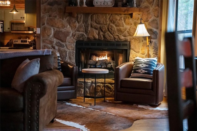 1073 Southern Hills Cir, Broken Bow, OK 74728 - sitting room featuring a fireplace and wood finished floors