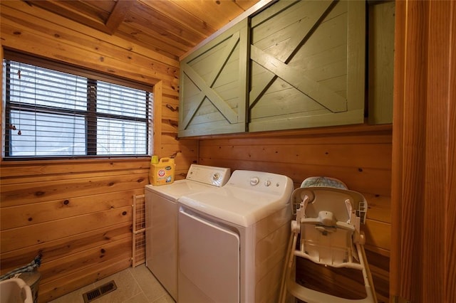 1073 Southern Hills Cir, Broken Bow, OK 74728 - laundry area with wooden walls, washer and clothes dryer, cabinet space, and wooden ceiling