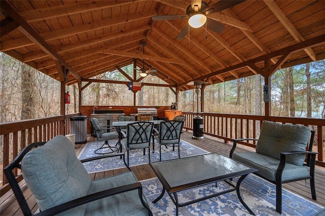 1073 Southern Hills Cir, Broken Bow, OK 74728 - wooden terrace with a ceiling fan, outdoor dining space, a gazebo, and an outdoor kitchen