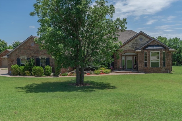108 Raye Pl, Tuttle, OK 73089 - french provincial home with a front lawn and brick siding