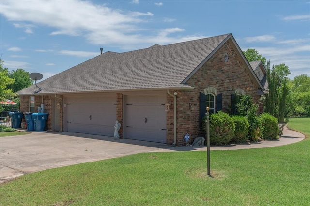 108 Raye Pl, Tuttle, OK 73089 - view of side of property featuring a garage, brick siding, a yard, and driveway