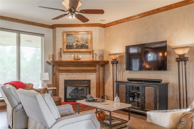 108 Raye Pl, Tuttle, OK 73089 - living area featuring crown molding, a fireplace, a ceiling fan, and wood finished floors