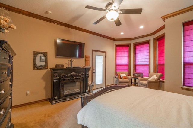 108 Raye Pl, Tuttle, OK 73089 - carpeted bedroom with a glass covered fireplace, ornamental molding, baseboards, recessed lighting, and a ceiling fan