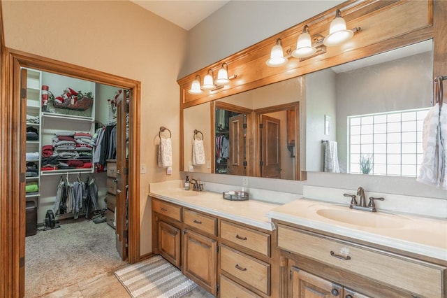 108 Raye Pl, Tuttle, OK 73089 - bathroom with double vanity and a walk in closet