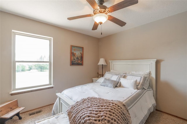108 Raye Pl, Tuttle, OK 73089 - carpeted bedroom with baseboards and ceiling fan
