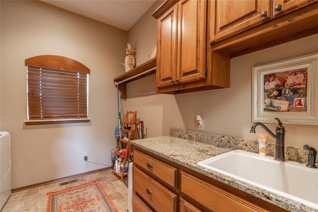 108 Raye Pl, Tuttle, OK 73089 - washroom with cabinet space and baseboards
