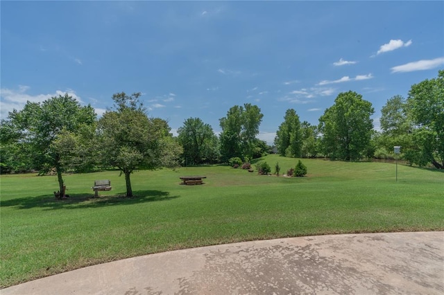 108 Raye Pl, Tuttle, OK 73089 - surrounding community featuring a yard and view of wooded area