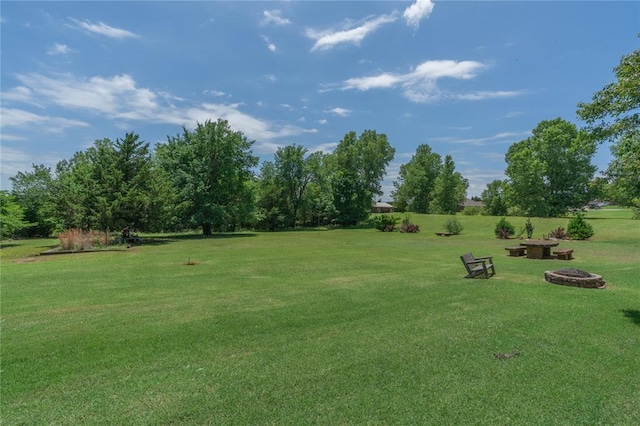 108 Raye Pl, Tuttle, OK 73089 - view of grassy yard featuring a fire pit