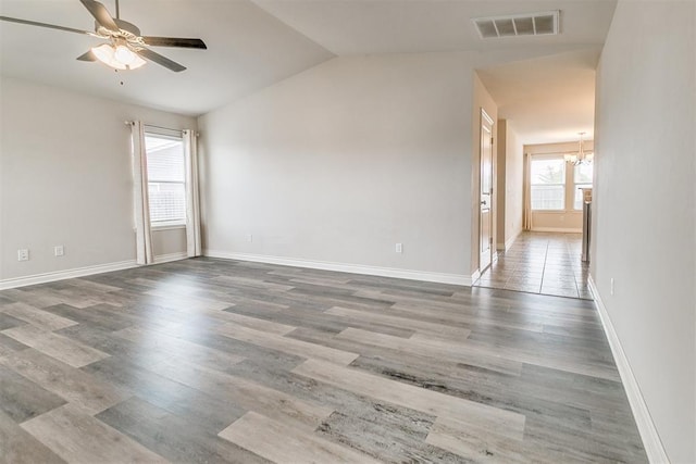 15108 Coldsun Dr, Oklahoma City, OK 73170 - unfurnished room featuring lofted ceiling, a chandelier, ceiling fan, and wood finished floors