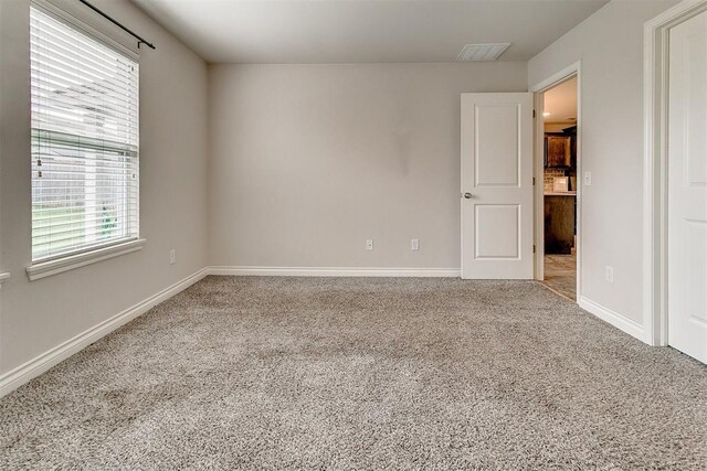 15108 Coldsun Dr, Oklahoma City, OK 73170 - carpeted empty room with baseboards