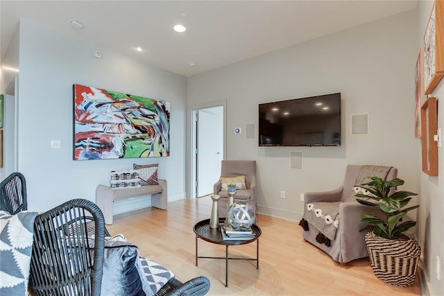 301 NE 4th St Unit 10, Oklahoma City, OK 73104 - living room with light wood-style flooring, recessed lighting, and baseboards
